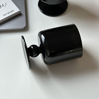 black stemmed glass